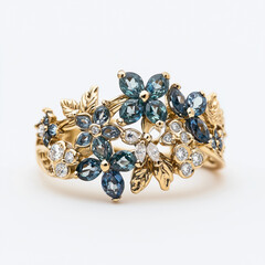 Wall Mural - Intricate gold ring featuring teal gemstones and sparkling diamonds in floral design.  
