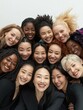 © Johannes - diversity, race, ethnicity and people concept - international group of happy smiling different women standing in circle and hugging over white