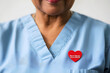 © ribalka yuli - Healthcare Worker Wearing World Blood Donor Month Pin