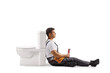 © Ljupco Smokovski - Tired plumber sitting next to a toilet