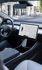 driver interacts with touchscreen navigation console with futuristic interface of electric modern ve