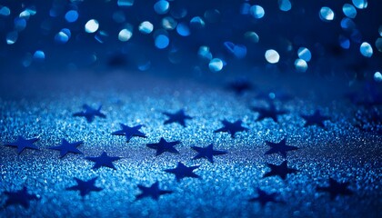 Wall Mural - Tiny star-shaped blue glitter pieces scattered on a deep blue background, with soft glowing