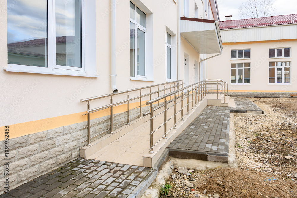 Disable Ramp Access Accessible entrance with wheelchair ramp and handrails for disabled ...