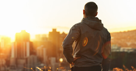 Poster - Man, runner and sunset with exercise, training and city view for fitness or cardio workout. Athlete, person and calm on mountain for wellness, health and summer marathon performance or endurance