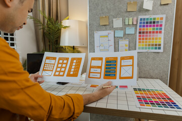 A web developer, as a User Experience and User Interface Officer, is designing beautiful and easy-to-use digital products that create a positive emotional and visual experience for users.