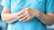 © NadenDesign - Healthcare professional's hands in action medical facility close-up image bright environment personal care context