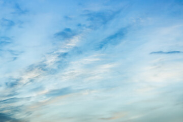 Wall Mural - a beautiful sky tinted by the sun leaving vibrant shades of gold, pink, blue and multicolored. cloud