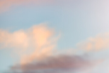 Wall Mural - a beautiful sky tinted by the sun leaving vibrant shades of gold, pink, blue and multicolored. cloud