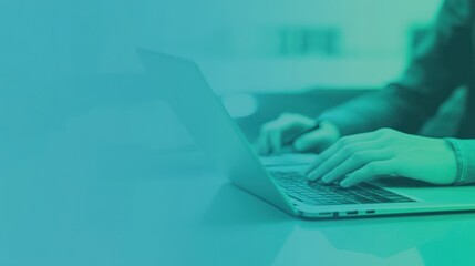 Leinwandbilder - A person typing on a laptop, focused on work or study.
