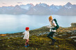 © EVERST - Mother and child having fun hiking in mountains happy family healthy lifestyle travel vacations outdoor, mom and daughter backpacking in Norway together, Mothers day holiday, candid emotions