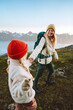 © EVERST - Mother and child hiking together follow holding hands travel in Norway, family vacations outdoor woman with kid healthy lifestyle active adventure tour - people backpackers exploring nature