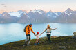 © EVERST - Family travel holidays in Norway - Mother, father, and child hiking together in mountains, parents and kid having fun on active outdoor vacations. People enjoying landscape, healthy lifestyle trip