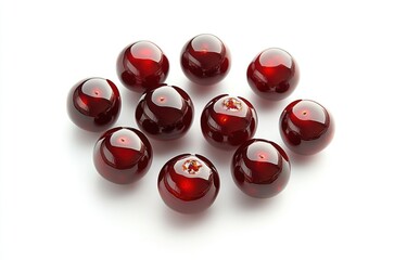 Fototapete - A collection of shiny red spheres arranged aesthetically on a white background.
