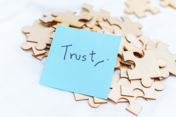 Poster - Building business trust analyzing puzzle pieces of confidence in corporate environment