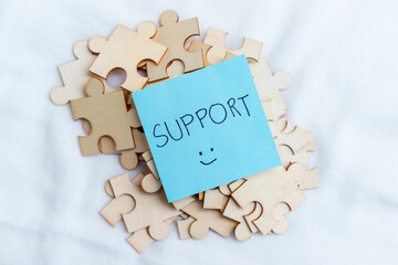Poster - Supporting business growth puzzle pieces and collaboration workspace visual content creative environment close-up problem-solving concept