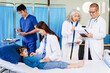 © NanSan - A doctor listens to a little girl’s heartbeat with a stethoscope while she lies on a bed in the hospital. The doctor is conducting a routine checkup to monitor her health