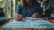 © ImagePulse - Startup professional reviewing customer lifetime value CLV charts alongside CAC metrics, financial balancing, detailed close-up