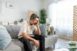 © Pavitra - Asian senior elderly depress man sitting alone in living room at home.