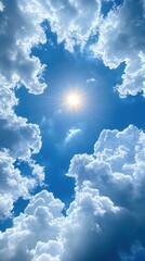 Wall Mural - Bright sun shining through fluffy clouds in blue sky.
