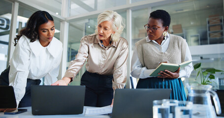 Leinwandbilder - Business women, meeting or discussion with laptop for project management, planning or collaboration at office. Female people, employee or colleagues working on computer for online report at workplace