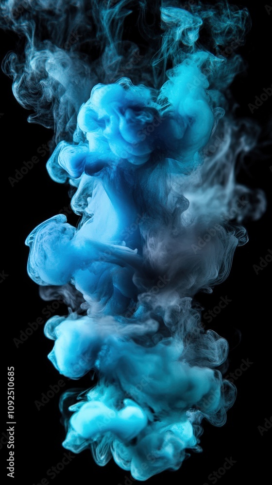Colorful blue and gray smoke rises and swirls against a black backdrop, creating an abstract visual effect. The dynamic movement showcases fluid shapes and textures in the air.