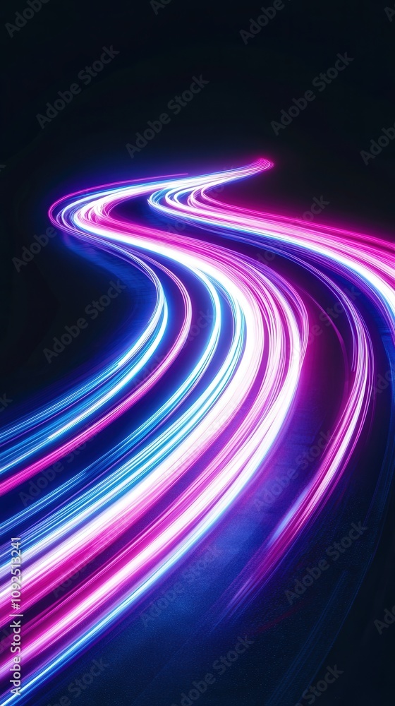 Bright neon light trails weave through a dark space, showcasing vibrant colors of blue and pink. This artistic display gives a sense of movement and energy in an urban environment.