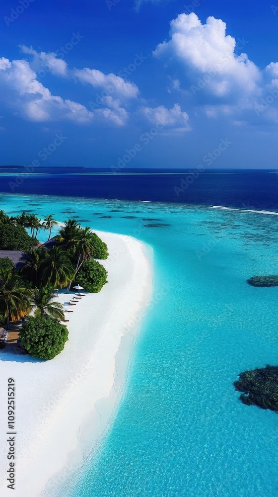 A breathtaking tropical beach showcases soft white sand and brilliant turquoise waters under a clear blue sky. Lush palm trees provide shade along the shoreline, creating a tranquil atmosphere.