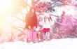 © alexkich - A winter fairy tale, a young mother and her daughter ride a sled in the forest.