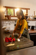© Wavebreak Media - Asian female teenager washing dishes in kitchen, preparing for dinner at home