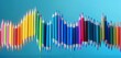 © Waqar - Colorful pencils forming a dynamic wave, isolated on a panoramic backdrop.