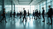© Ai_Stock - Vivid Long-Exposure Blur of Business Professionals Moving Swiftly Through a Bright, Modern Office Lobby, Capturing Energy and Momentum