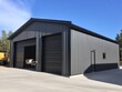 © Gophotograph - Commercial garage building featuring a straight wall steel design.