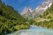 © Yuliia - Val Veny scenic landscape in Courmayeur valley, Italy on Tour du Mont Blanc hiking route. Alps beautiful landscape, scenic view of the alpine peaks, green fields and meadow with flowers and blue sky