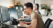 © Clement C/peopleimages.com - Computer, typing and web development with happy man in creative workplace for coding or design. Cybersecurity, language and system infrastructure with smile of employee person in office as developer