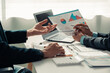 © ArLawKa - Business people discuss charts and graphs showing successful teamwork in data company growth proposal. Analytical statistics, infographics and strategy ideas