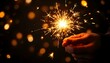 © burhanuddin - Vector Illustration of a Hand Holding a Sparkler with Bright Sparks on a Dark Background