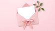 © Tichila - Valentine's day decorations open pink envelope with paper sheet on background with empty space.