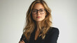 © Chalita - Confident Businesswoman with Glasses and Long Hair Posing Elegantly Against a Neutral Background, exuding Professionalism and Poise in a Modern Corporate Atmosphere