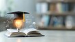 © NKCoolper - educational theme with a glowing lightbulb sitting on an open book capped with a graduation hat surrounded by icons of online learning and e degree concepts set in a dreamy bokeh environment