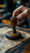 © queen - Photo Hand Holding Wooden Stamp on Vintage Paper