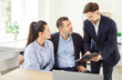 © Studio Romantic - Professional realtor explaining terms of contract to clients. Family couple customers sitting at office desk, listening carefully, buying or renting house, signing contract in real estate agency.