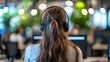© basketman23 - Woman in Headphones at Modern Office Workspace