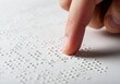 © OksKutsenko - Celebrating world braille day with tactile reading for blind awareness and inclusion