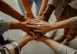© Anna - Diverse group hands together show unity and teamwork