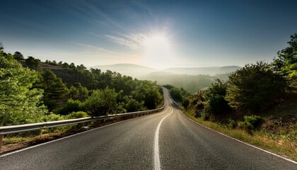 Wall Mural - Scenic winding road through lush green hills bathed in morning sunlight.