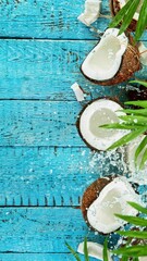 Poster - Super Slow Motion Shot of Falling Coconut on Wooden Background, top shot, 1000 fps.