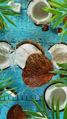 Fototapete - Super Slow Motion Shot of Falling Coconut on Wooden Background, top shot, 1000 fps.