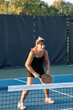 © pics721 - Female Pickleball Player At Net