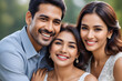 © Hakim - Happy indian family smiling together outdoors
