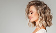 © Sofia Zhuravetc - Beautiful  blonde model  girl  with short  curly  hair . Smiling  woman hairstyle wavy curls .     Fashion , beauty and makeup portrait
